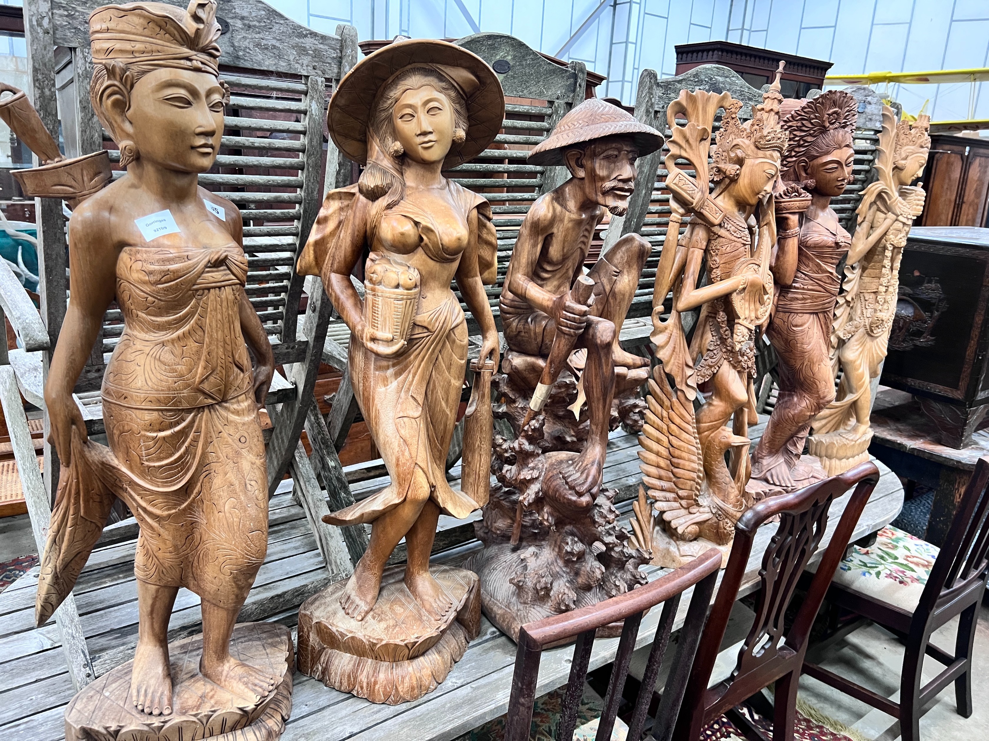 Six Balinese carved hardwood figures, largest height 104cm *Please note the sale commences at 9am.
